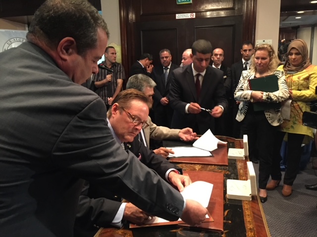 Dale Didion contract signing with Mahmoud Benchekor, president of the Interprofessional Council for Milk (CIL) in Algeria. This is part or Algerian Government effort to establish food self sufficiency and the dairy sector.